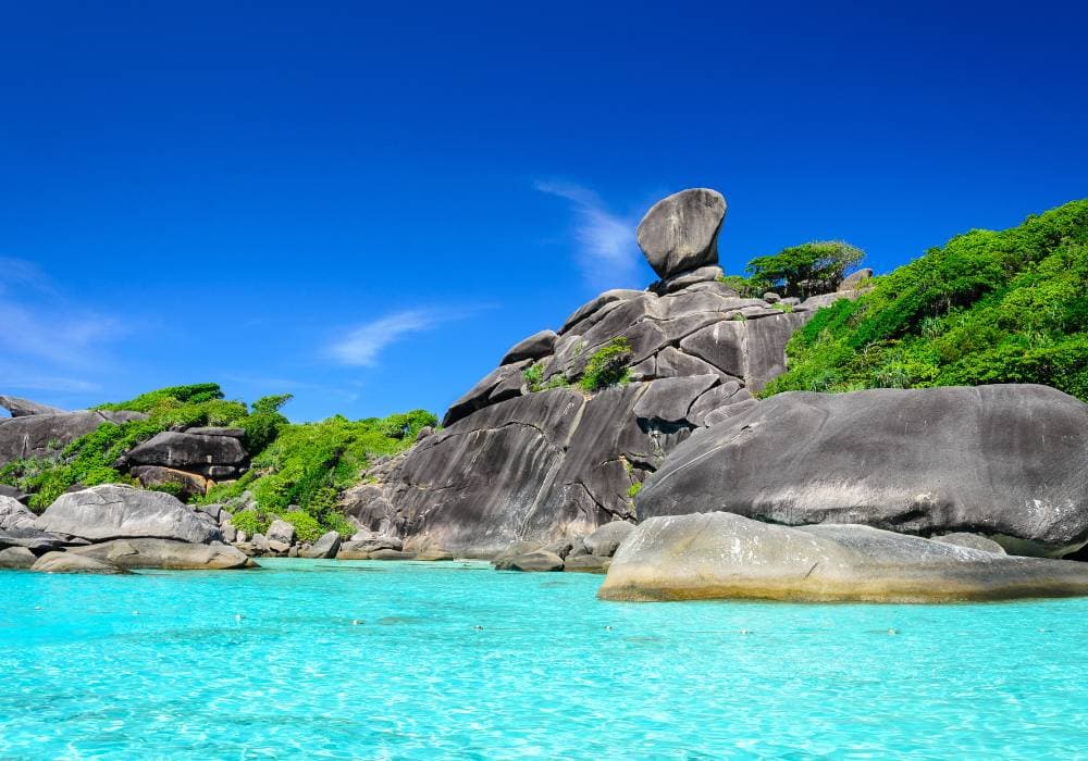 similan islands very bright blue water with unique shaped rocks