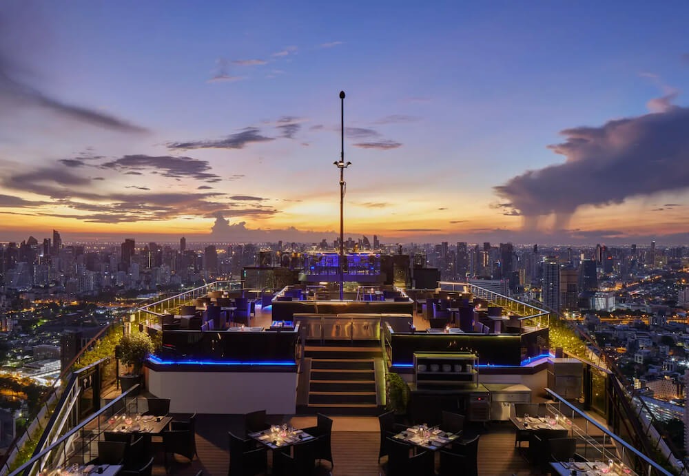 Seating area at Vertigo rooftop with city views of Bangkok